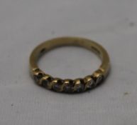 A seven stone diamond 9 ct gold ring