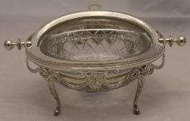 A glass and silver plated breakfast dish