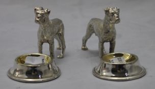A pair of silver plate dog form salts