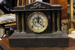 A Victorian faux marble mantle clock
