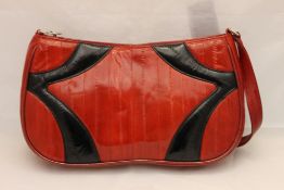 A red and black leather handbag