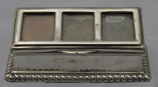 A silver stamp box