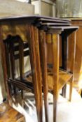 An Edwardian line inlaid mahogany quartetto nest of tables