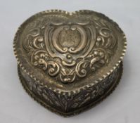 A silver heart shaped box