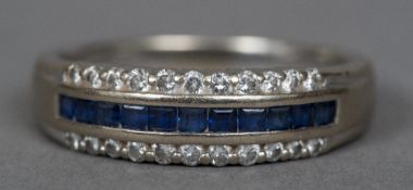 An 18 ct white gold diamond and sapphire ring,