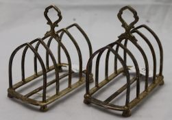 A pair of silver toast racks