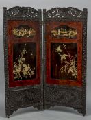 A late 19th century Japanese ebonised and lacquered two fold screen,