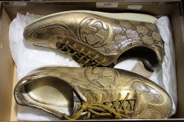 A pair of Gucci trainers,