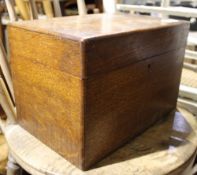 An early 20th century oak sewing box