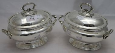 A pair of silver plated soup tureens