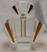 A large amber and clear glass fan shape scent bottle