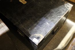 A black painted tin trunk