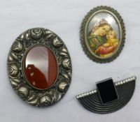 Three silver brooches