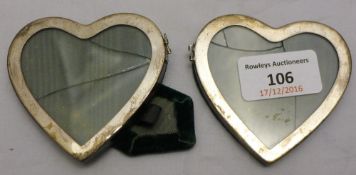 An unmarked silver double heart photograph frame