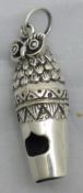 A silver whistle in the form of an owl