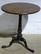 An 18th century oak tripod table