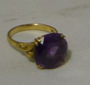 An 18 k gold amethyst ring