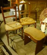 A pair of bedroom chairs and a stool