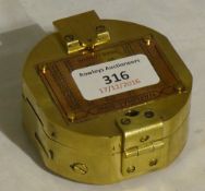A brass cased compass
