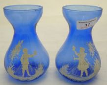 Two Mary Gregory type blue glass vases