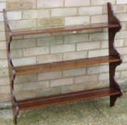 A mahogany hanging bookshelf