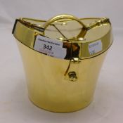 A miniature brass hat box