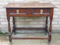 A 19th century oak single drawer side table