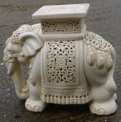 A white glazed ceramic elephant garden seat