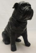 A bronze figure of a seated bulldog