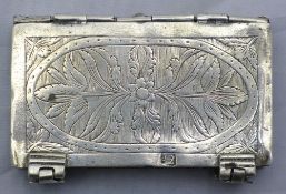 A silver snuff box in the form of a book