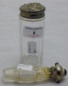 Two silver topped bottles
