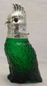 A silver plated green glass claret jug formed as a bird