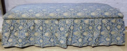 An upholstered ottoman and a plantation chair