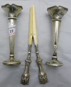 A pair of silver bud vases and a pair of silver and ivory glove stretchers