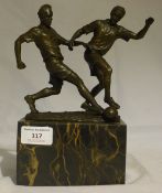 A bronze in the form of footballers