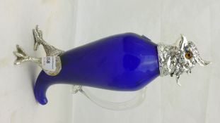 A silver plated blue glass claret jug formed as a bird