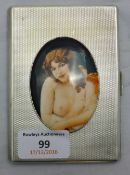 A silver cigarette case depicting a nude lady