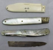 A 19th century mother-of-pearl handled fruit knife, another (a/f) and another,