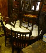 An Ercol table and six chairs