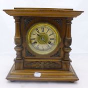 A Victorian walnut cased mantle clock