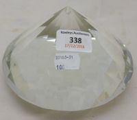 A paperweight in the form of a large diamond