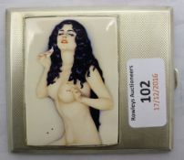 A silver cigarette case depicting a nude woman