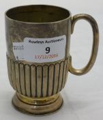 A silver 1/4 pint mug