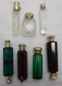 A quantity of silver topped scent bottles etc