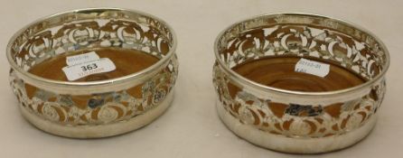 A pair of silver plated coasters
