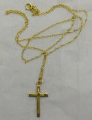 A gold crucifix and chain