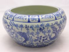 A Chinese blue and white bowl decorated with fish