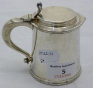 A silver plated small tankard