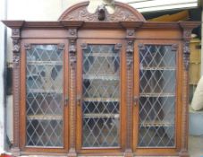 A 19th century carved oak bookcase top