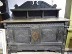 An 18th century carved oak sideboard
